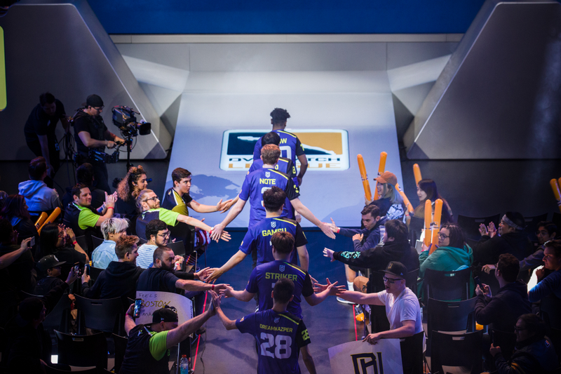 Boston Uprising, led by support players Snow and Neko, walk into the Blizzard Arena (image via Blizzard Entertainment)